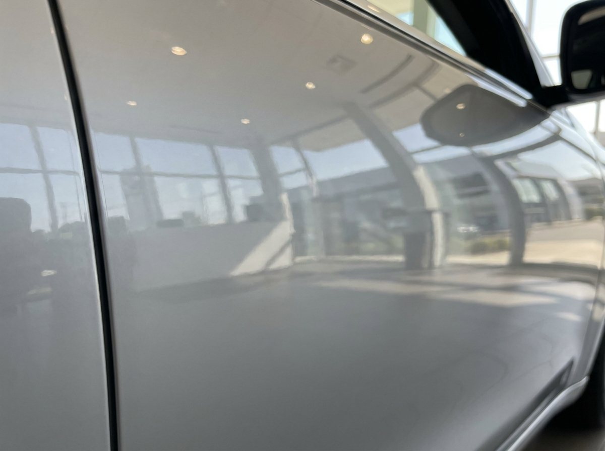 The same car panel smooth and dent-free, after paintless dent repair